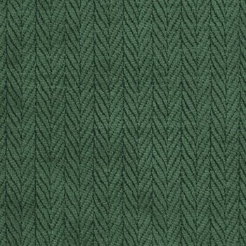 a green fabric textured with small, wavy lines on the outside and inside of it