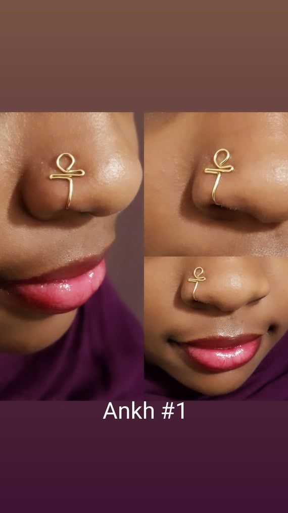 the nose has two piercings on it, and one is gold with an anchor