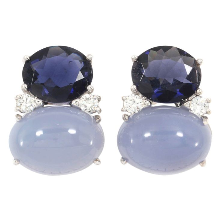 Christina Addison bespoke Large 18kt white gold GUM DROP�™ earrings with iolite (approximately 5 cts each), chalcedony cabochon (approximately 12 cts each), and 4 diamonds weighing 0.60 cts. Specifications: Height: 7/8", Width: 5/8" Omega clip back. These earrings can be made for Clip or Pierced earrings. The Christina Addison Fine Jewelry Bespoke Collection is made to order to your ring size. You may select whichever color stones you would like to match your outfit or your mood! Please contact u White Jade Necklace, Iolite Jewelry, Gum Drop, Ear Tops, Architectural Jewelry, Fine Jewelery, Jade Necklace, Classy Jewelry, White Jade