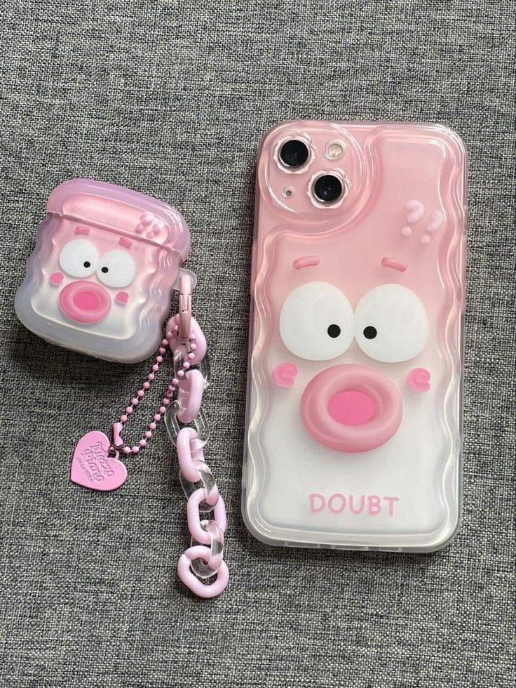 an iphone case with a pig face on it and a keychain attached to it