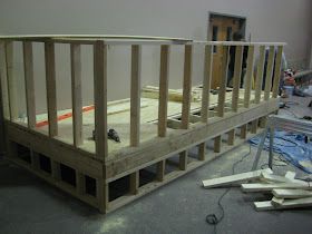 an unfinished bed frame being built in a room