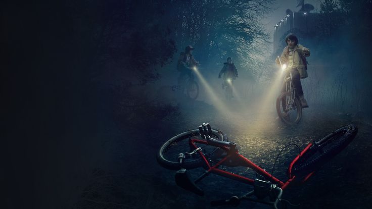 people riding bikes in the woods at night with flashlights on their heads and hands