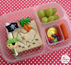 a plastic container filled with food on top of a table