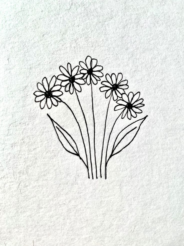 some black and white flowers on a white paper