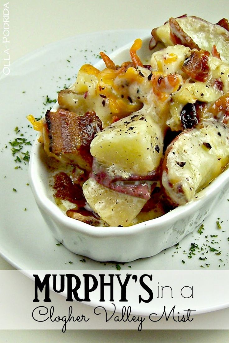 a white bowl filled with potatoes and bacon