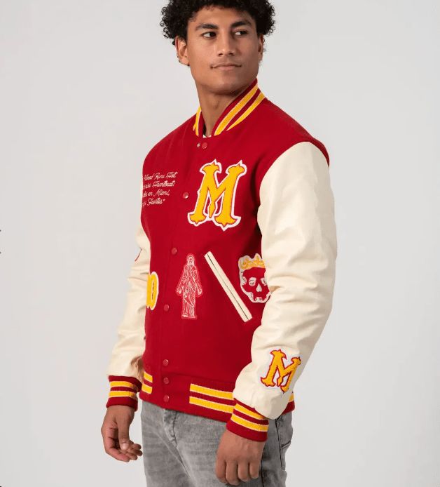 Miami Heritage Varsity Bomber Jacket In Red Unleash vibrant style with the miami heritage varsity bomber jacket. Crafted from premium wool with a quilted inner shell, it offers both warmth and trendiness. The Miami Heritage Edition detailing adds an exclusive touch. Snap button closure, rib-knit collar and cuffs, and two side pockets combine for a classic varsity look. Make a statement in bold red. Outer Shell: Wool Inner Shell: Quilted Feature: Miami Heritage Edition Closure Style: Snap Buttons Collegiate Red Hooded Outerwear, Casual University Red Varsity Jacket For College, Sporty Red Outerwear For College, Red Collegiate Varsity Jacket For Winter, Urban Red Long Sleeve Varsity Jacket, Red Collegiate Varsity Jacket For Fall, Sporty Red Varsity Jacket For Fall, Red Sporty Varsity Jacket For Fall, Casual Red Varsity Jacket For Streetwear