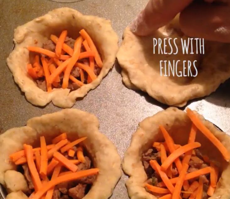 four pies with carrots and meat in them