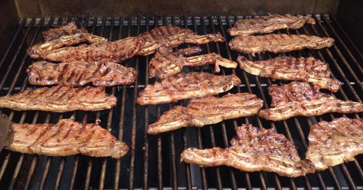 steaks are cooking on the grill and being grilled