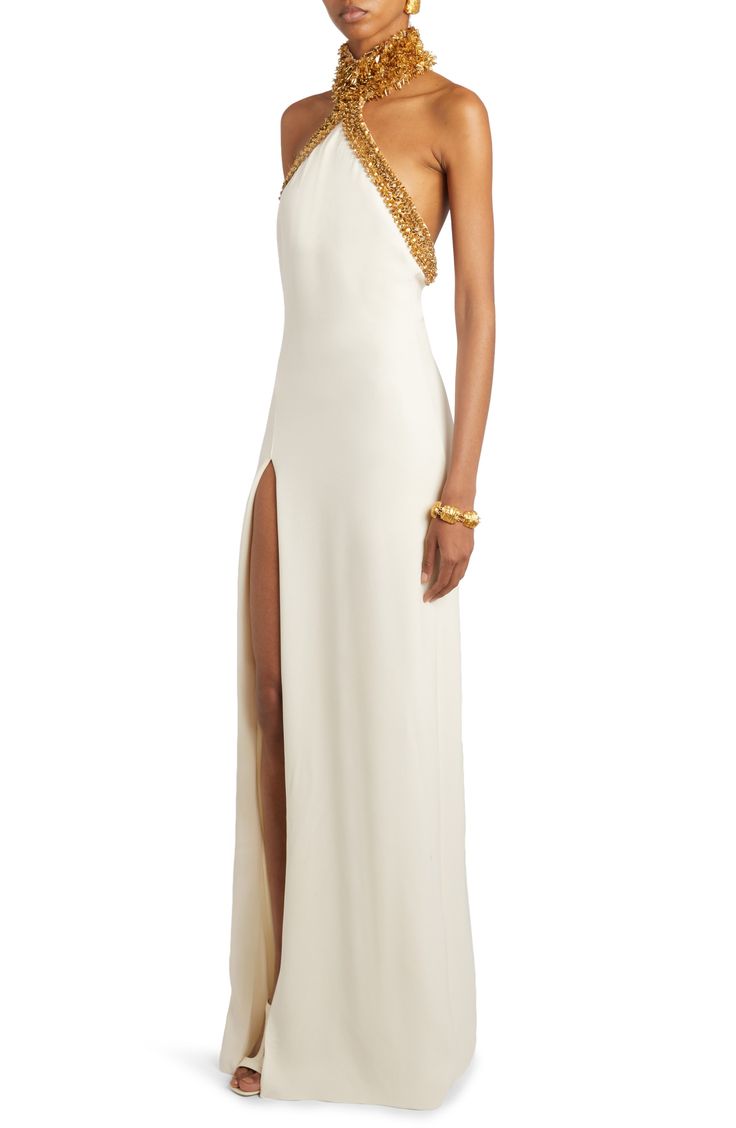 Shimmering goldtone sequins and bugle beads illuminate the halter neck of this elegant stretch-silk gown made extra-alluring via a thigh-high front slit. 29" to 66" center front length (size 42IT) Hidden back-zip closure Halter neck Lined 94% silk, 6% elastane Dry clean Made in Italy Designer Clothing Egyptian Formal Dress, New Years Gown, Haute Couture Gowns Wedding, Gold Red Carpet Dresses, High Fashion Gowns Couture, Goddess Style Dress, Resort 2025 Fashion Trends, White Red Carpet Dresses, Tom Ford Gown