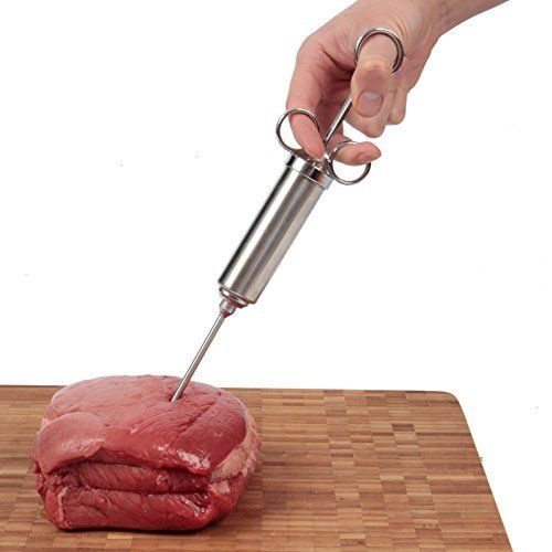 a piece of meat being cut with a knife