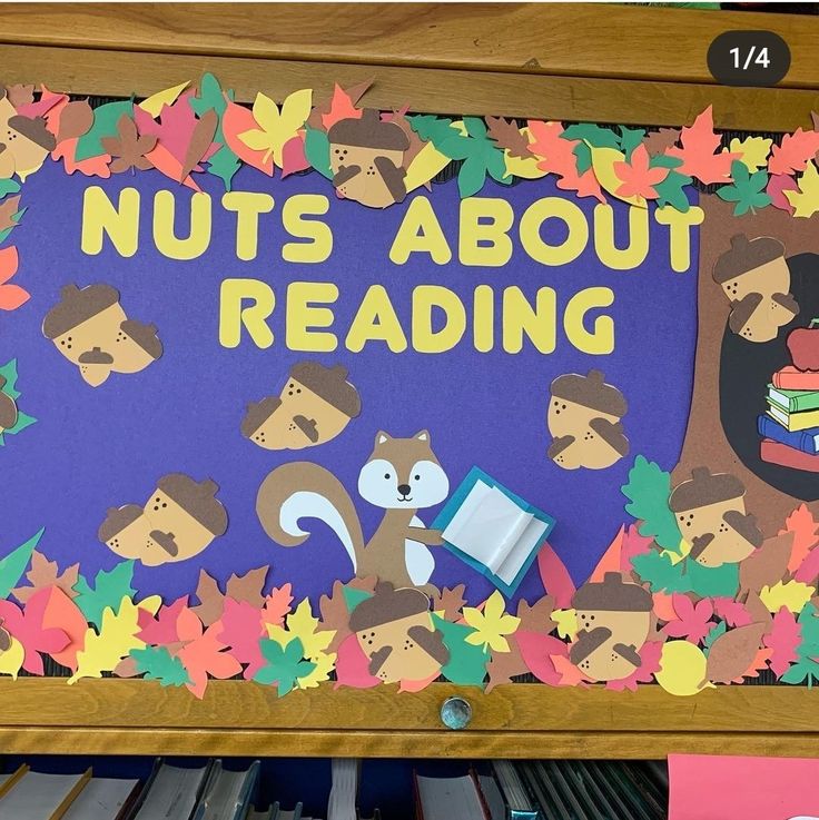 a bulletin board that says nuts about reading with an image of animals and leaves on it