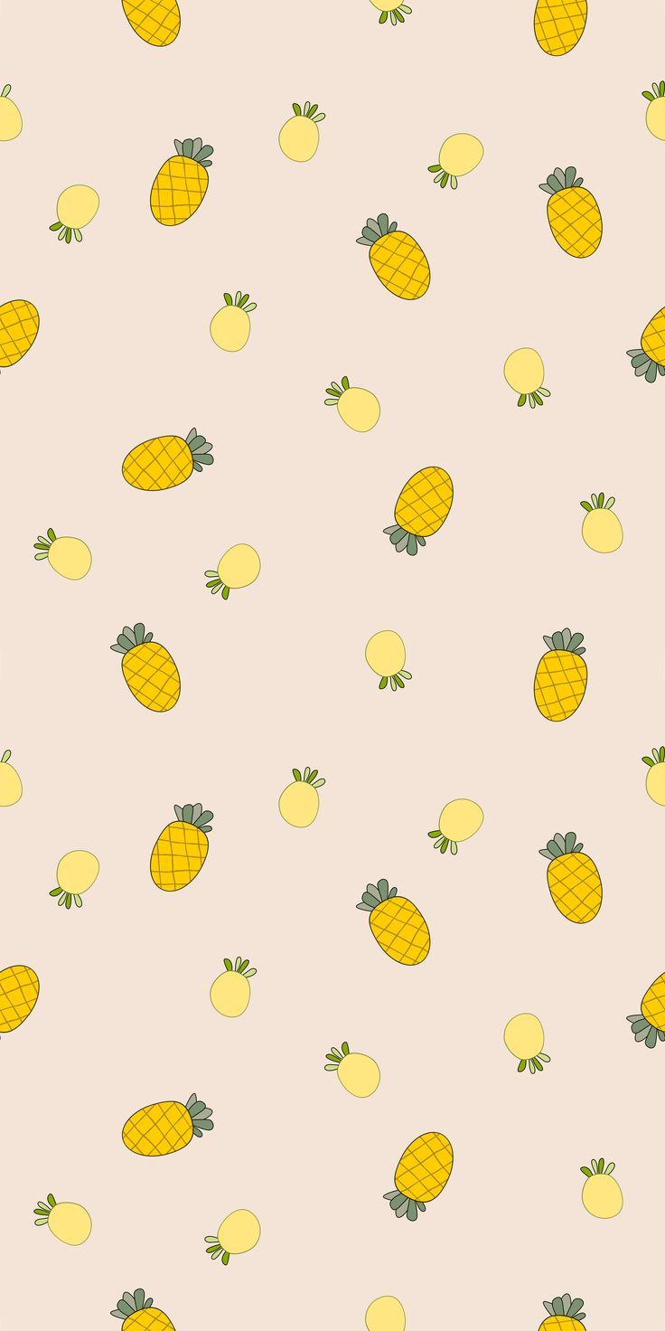 a bunch of yellow pineapples on a pink background