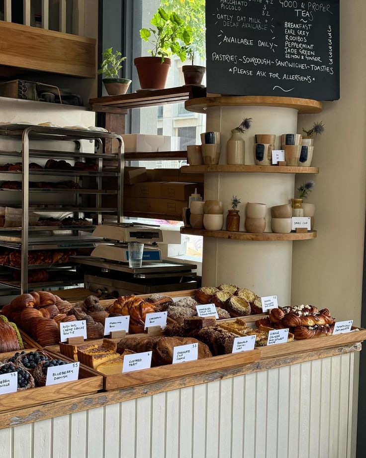 breads and pastries on display in a bakery