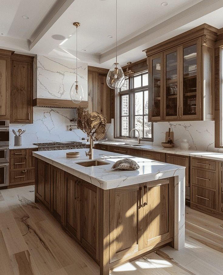 a large kitchen with wooden cabinets and marble counter tops