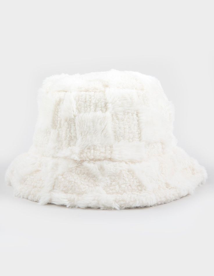 Checkered Fur Bucket Hat. Fur Bucket Hat With Checkerboard Pattern. Approximate Crown Height: 4". Approximate Brim Width: 2". 100% Polyester. Hand Wash. Imported. Trendy White Winter Bucket Hat, White Winter Bucket Hat With Short Brim, White Brimmed Bucket Hat For Winter, White Short Brim Bucket Hat For Winter, White Bucket Mini Hat One Size, White Flat Brim Winter Hat, White Wide Brim Mini Hat For Winter, White Bucket Hat Mini Size, White Brimmed Hat One Size