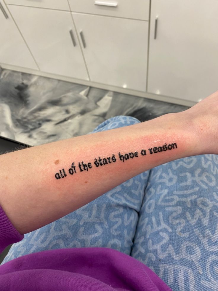 a person with a tattoo on their arm that reads, out of the states have a reason