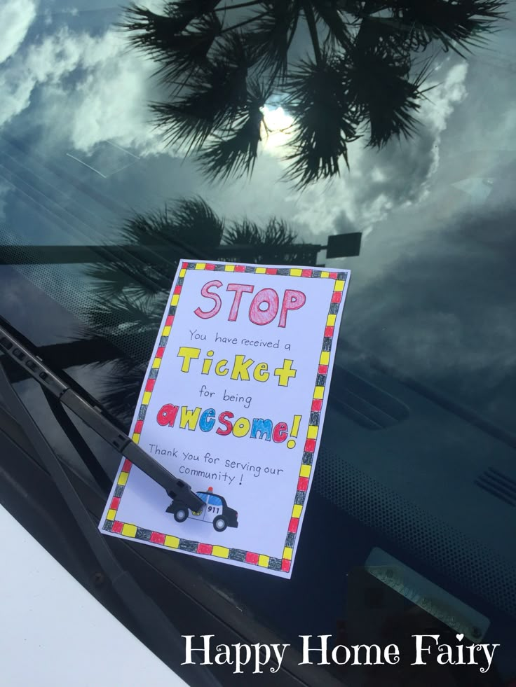 there is a sign that says stop ticket for the awesome mom in front of her car