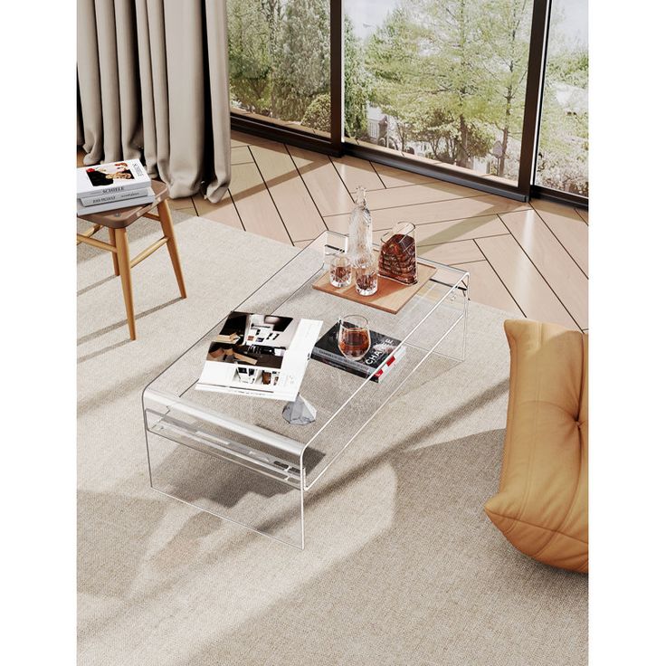 a glass coffee table sitting on top of a carpeted floor next to a window