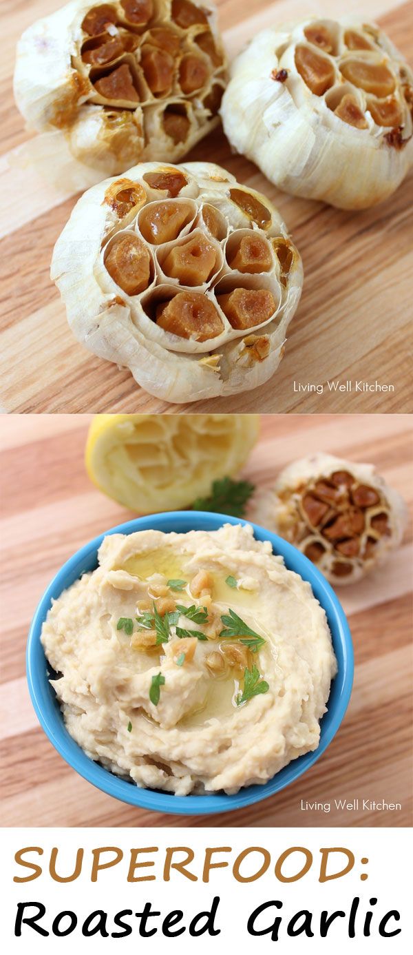 some food that is sitting on top of a wooden table and in a blue bowl with the words superfood roasted garlic hummush