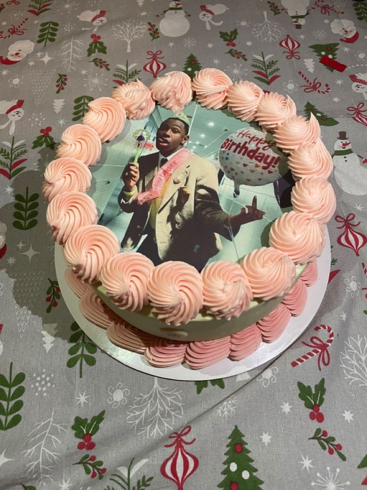 a birthday cake decorated with pink frosting and an image of martin luther king on it