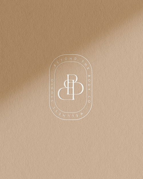 a brown paper with the letter b on it and a white monogrammed logo