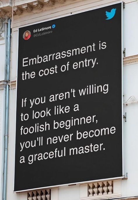 a large sign on the side of a building that says, embarrassedment is the cost of entry if you aren't wiling to look like a fool