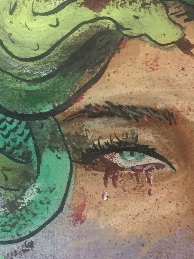 a close up of a painting on the side of a wall with eyes and leaves