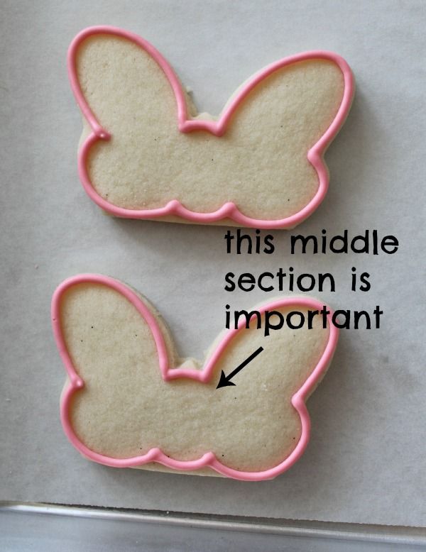 two cookies that have been made to look like the shape of a butterfly on top of each other