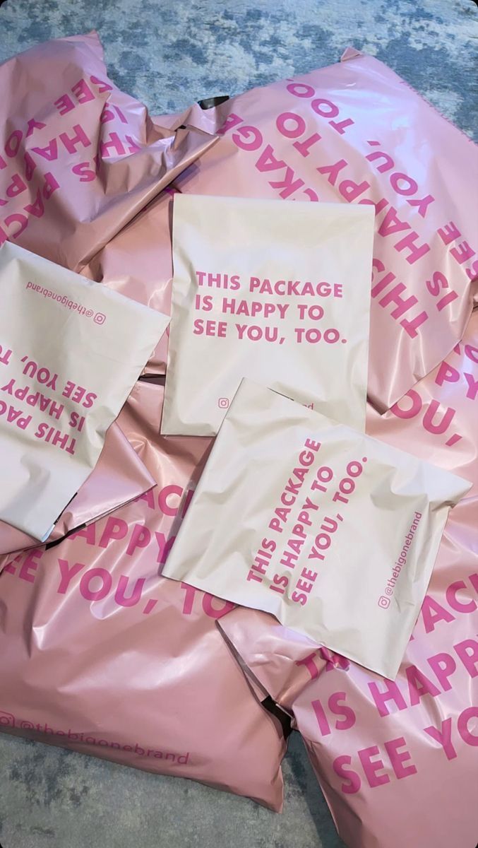 pink and white bags with messages on them