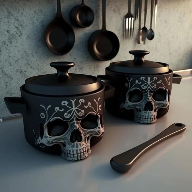 two sugar skulls are sitting next to pots and pans on a counter top with utensils