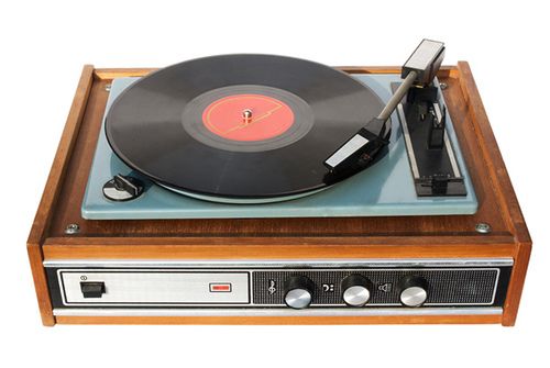 an old fashioned record player with its turntable on it's wooden stand, against a white background