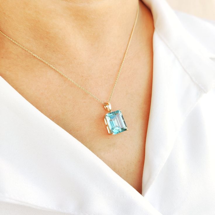 This stunning pendant is set in 14K Solid Yellow Gold studded with Aqua Hydro in classic prong setting. It is an unique gemstone pendant for nearly every occasion and is completely hassle-free jewelry. ◾ITEM DETAILS * Gem: Aqua Hydro * Gem Size: 10X12mm * Gem Shape: Octagon cut * Gem Weight: 7.50 carats * Gold Purity: 14KT  * Gold Weight: 0.97gram * Total Weight of the Pendant: 2.47 gram The Gold purity is guaranteed and it comes with authentic 14KT gold hallmark. Since my items are handmade, th Exquisite Emerald Cut Gemstones For Gift, Elegant Rectangular Pendant Jewelry For Anniversary, Classic Gemstone Accented Necklaces For Anniversary, Classic Gemstone Accents Necklaces For Anniversary, Classic Jewelry With Large Pendant For Anniversary, Classic Necklaces With Gemstone Accents For Anniversary, Elegant Large Pendant Jewelry As Gift For Her, Elegant Emerald Cut Birthstone Gemstones, Elegant Necklace With Gemstone Accents For Gifts