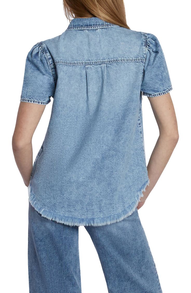 Charming puff sleeves frame this casual-cool denim shirt punctuated with a feathery frayed hem. 24" length Spread collar Short sleeves 100% cotton Machine wash, tumble dry Imported Light Wash Button-up Top With Frayed Hem, Distressed Denim Blue Tops For Fall, Button-up Denim Top With Frayed Hem, Denim Blue Button-up Top With Frayed Hem, Spring Medium Wash Shirt For Casual Gatherings, Trendy Light Wash Denim Top With Frayed Hem, Medium Wash Shirt For Casual Spring Gatherings, Trendy Frayed Hem Denim Top For Fall, Trendy Spring Denim Top With Puff Sleeves