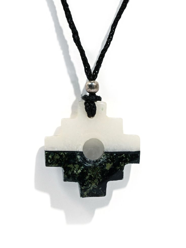 The Andean symbol of the Incan civilization, our chakana talisman necklace is created from black and white stones in a horizontal pattern. Derived from Quechua, the traditional language of the Incas, the word chakay, means to cross or to bridge, between this world and the other worlds. A chakana is a 3-stepped symmetric cross, sometimes with a hole in the center. Strung on a black cord with a silver-tone accent bead. Each item is unique and handmade in Peru. Choice of white top or black top. Symbolic Black Medallion Necklace, Traditional Black Medallion Necklace, Traditional Black Medallion Shaped Jewelry, White Symbolic Pendant Necklace, Symbolic White Medallion Necklace, Incan Civilization, Talisman Necklace, White Stones, Ancient Wisdom