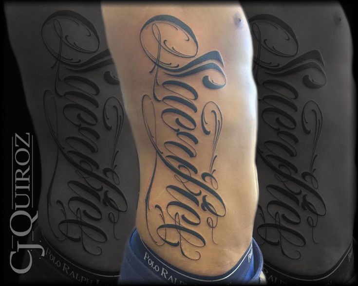 a man's lower leg with some lettering on it