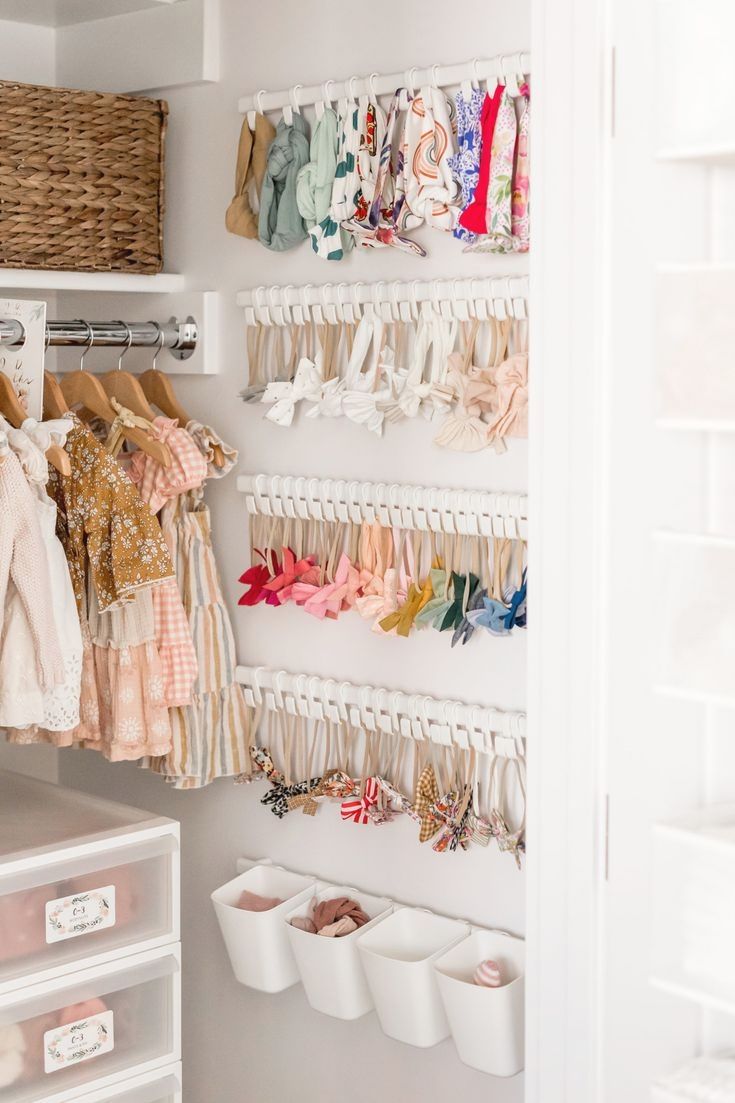 the closet is full of baby clothes and other things to put on it's shelves