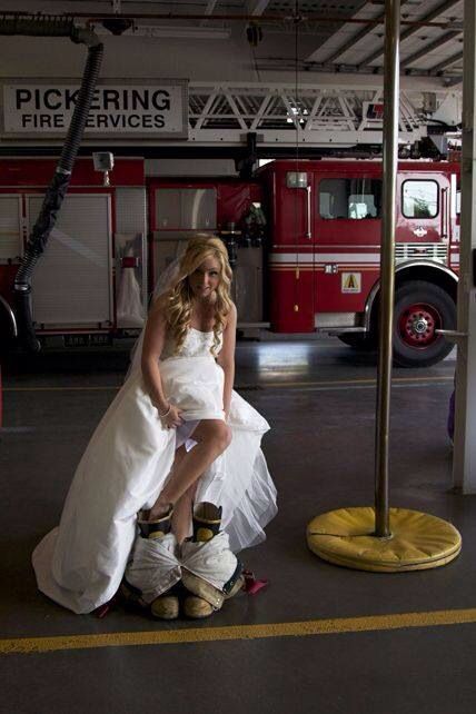 a woman in white dress sitting on fire hydrant