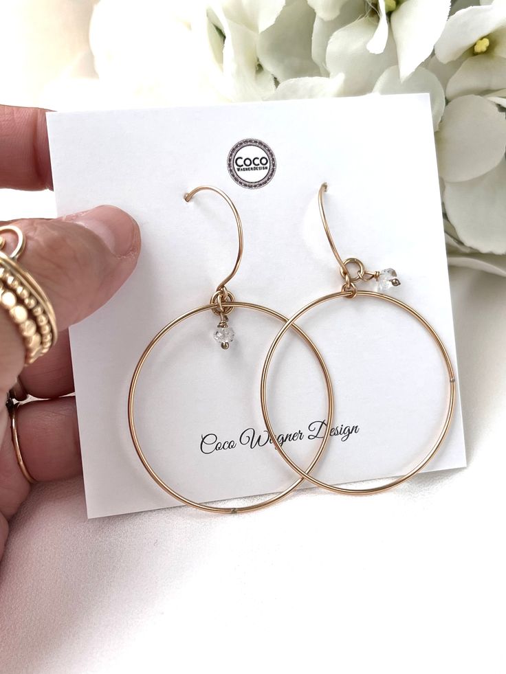 Just as effortless as they are simple, these hoop earrings are an essential everyday piece. Item Details: • This listing is for A PAIR ( 2 pieces ) earrings.• All metal is components are sterling silver and 14k gold-fill• Hoops measure 40mm in diameter.• Herkimer quartz crystals prized, each Herkimer diamond is a natural entity and no stone is identical.• The order will arrive in a gift-wrapped box and free polishing cloth. It will be ready for gift giving. All our work is custom-made by hand in Delicate Everyday Hoop Jewelry, Simple Small Hoop Everyday Jewelry, Everyday 14k Rose Gold Hoop Earrings, Everyday Rose Gold 14k Hoop Earrings, Everyday Circular 14k Gold Filled Jewelry, Everyday 14k Gold Filled Circular Jewelry, Nickel-free Small Hoop Earrings In 14k Gold Filled, Simple 14k Gold Tarnish Resistant Hoop Earrings, Simple 14k Gold Hoop Earrings