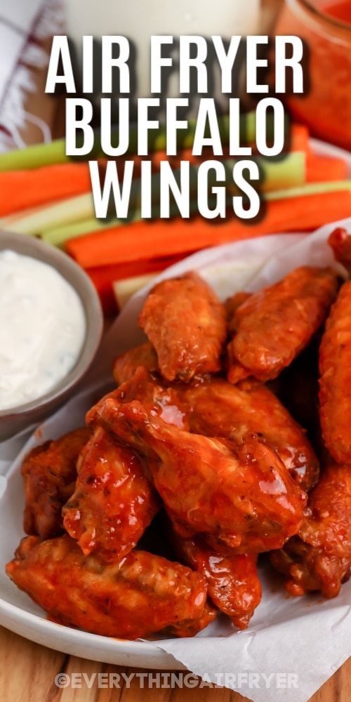 air fryer buffalo wings on a plate with ranch dressing