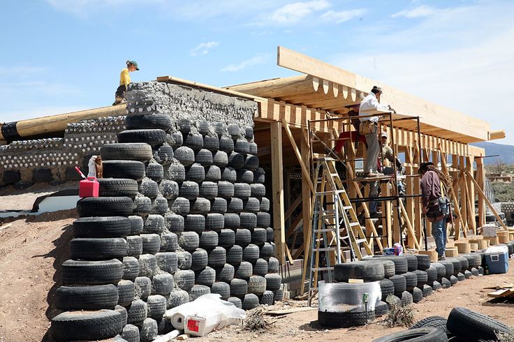 some people are building a house made out of old tires