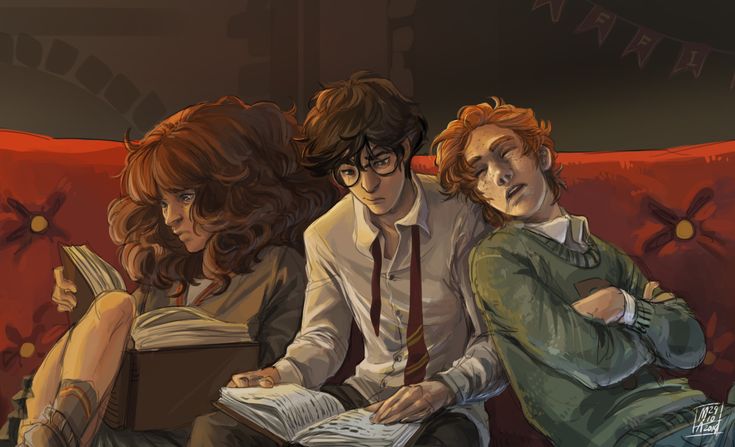 three people sitting on a red couch with one reading a book and the other looking at something