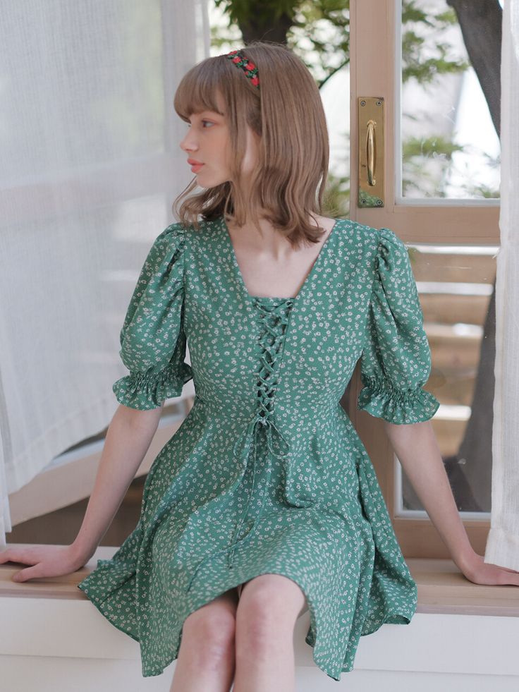 Editor's NotesDaisy Puff Dress GREEN from AVANDRESS is a dress product made of fabric with a daisy pattern. It has a string detail on the front. The back of the dress has a zip closure.- Puff sleeves- String details- Zipper detail- High quality stitchesMeasurements (in.)- S / M- Length: 31.8 / 32.2 in.- Shoulder: 12.9 / 13.3 in.- Chest: 16.9 / 17.9 in.- Sleeve: 12.5 / 12.9 in.*Model InformationModel 1- Height: 5'6" Top: S Bottom: MModel 2- Height: 5'6" Top: S Bottom: MComposition & Care- 100 Cute Green A-line Dress, Green Puff Sleeve Midi Dress With Floral Print, Green Floral Mini Dress With Ruffles, Green Floral Print Midi Dress With Puff Sleeves, Green Puff Sleeve Mini Dress For Summer, Green Knee-length Dress With Tie Back, Green Mini Floral Dress For Garden Party, Green Fitted Puff Sleeve Dress For Garden Party, Green Floral Mini Dress For Garden Party