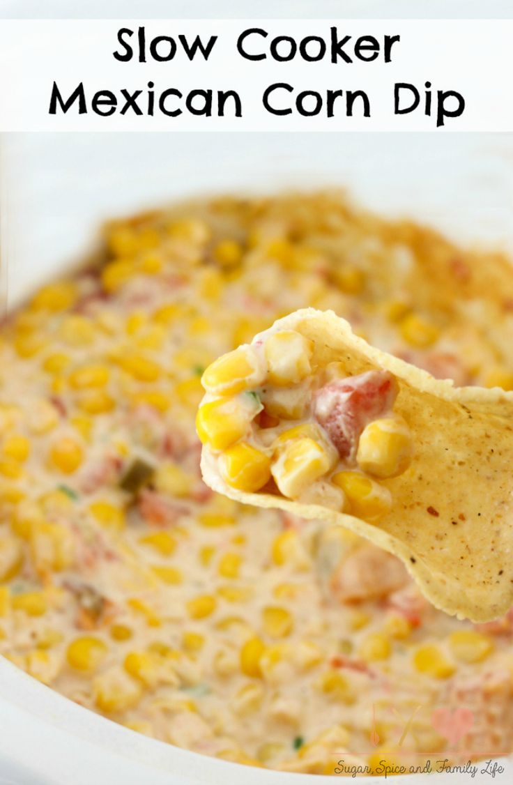 a tortilla chip being held up to the camera with text overlay that reads mexican corn dip