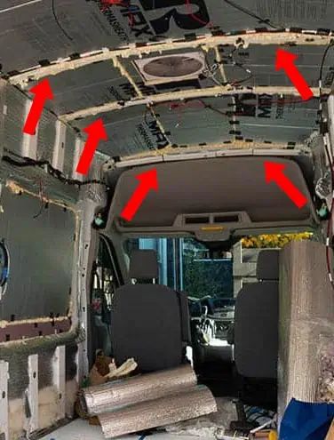 the inside of an old van with red arrows pointing to different parts in it and on the floor