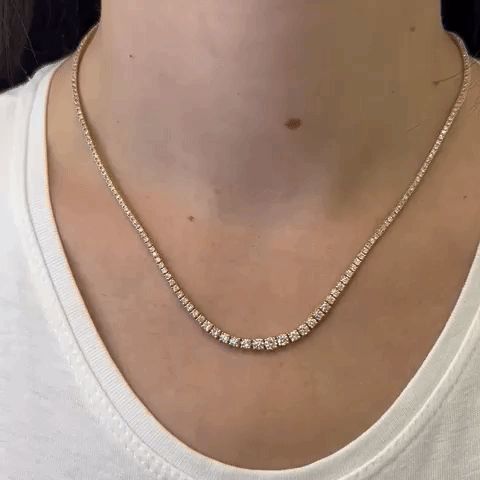 The Riviera Diamond Tennis Necklace is an exquisite piece of jewelry that combines elegance and timeless beauty. This necklace features a total carat weight of 4.00 ct., showcasing a dazzling array of diamonds. The diamonds used in this necklace range in size from 2.60 mm to 4.60 mm, creating a captivating visual effect with their varying sizes. The necklace is crafted with meticulous attention to detail and is set in a 4-Prongs Setting, which is known for its graceful and secure design. This ty Gold Tennis Necklace, Diamond Tennis Necklace, 14k Yellow Gold Necklace, Shimmer And Shine, White Gold Necklaces, Tennis Necklace, Rose Gold Necklace, Box Chain, White Diamonds