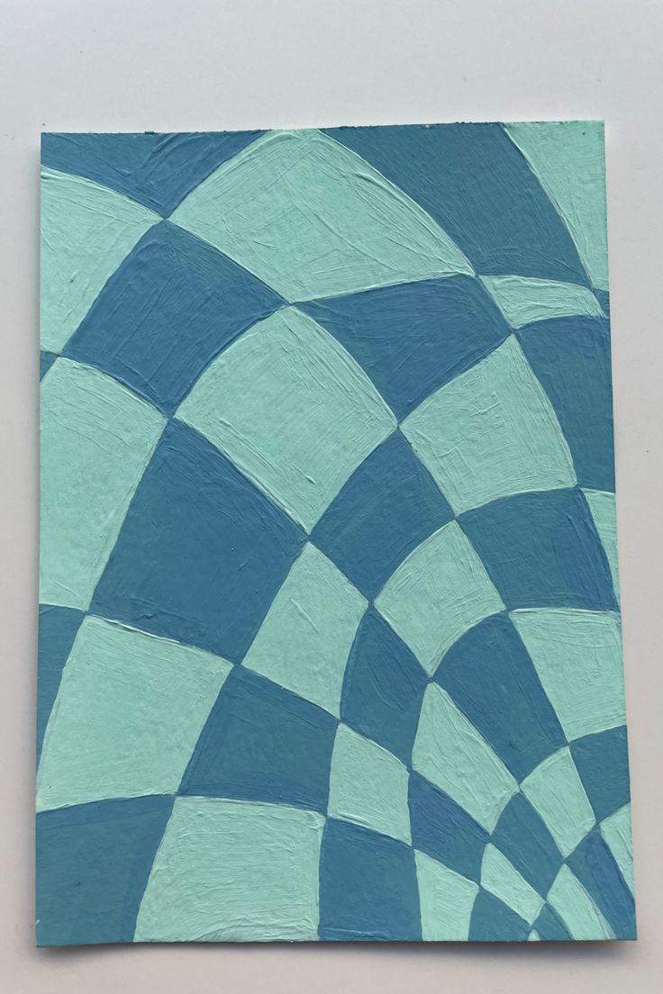 a blue and white checkered painting on a wall