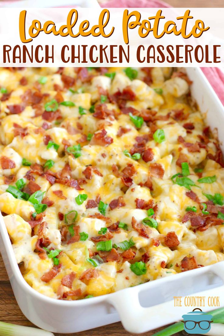 loaded potato ranch chicken casserole in a white dish with green onions and bacon