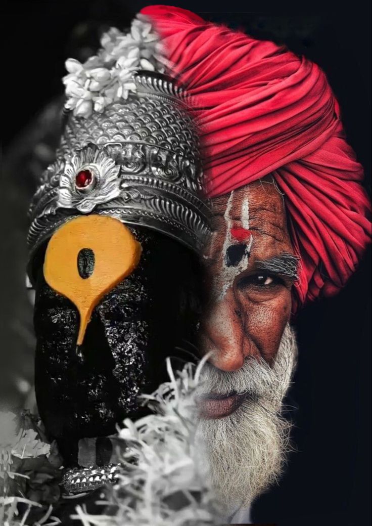 an old man wearing a red turban and black mask with feathers on his head