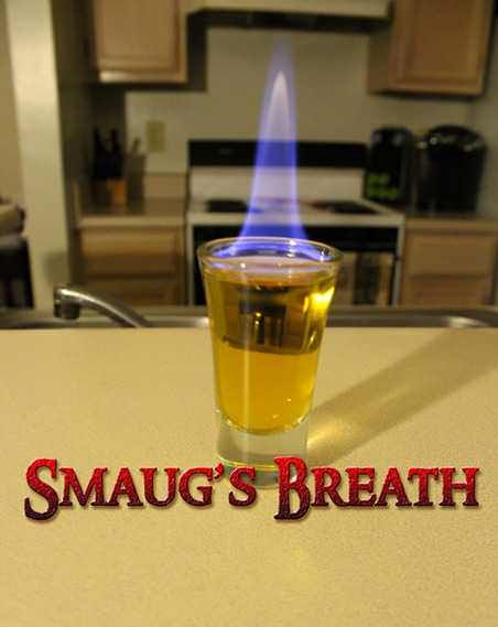 a shot glass sitting on top of a counter with the words smaug's breath