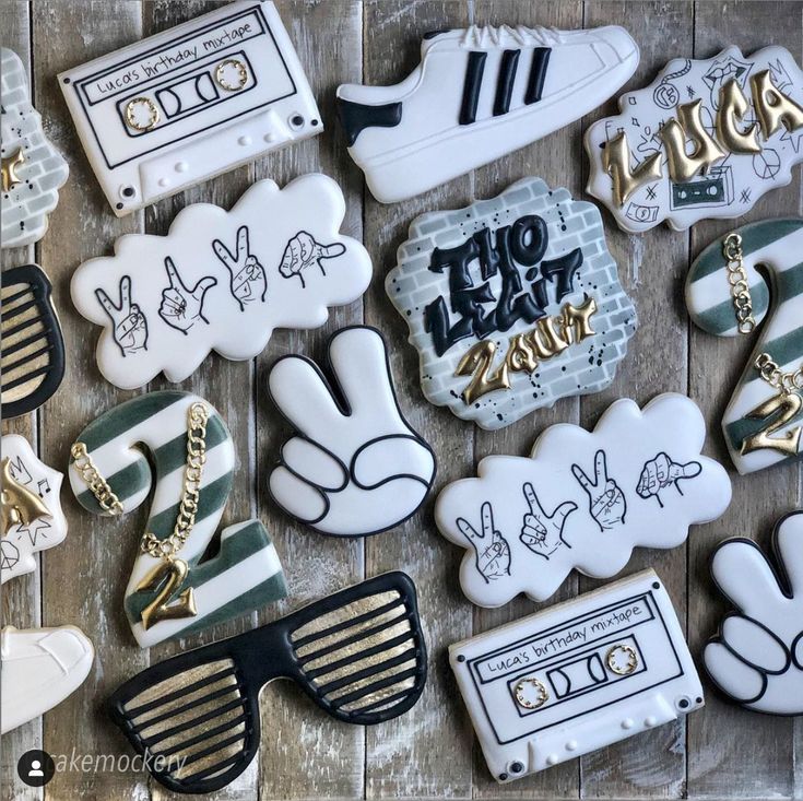 decorated cookies are arranged in the shape of hip hops and cassette tape recorders